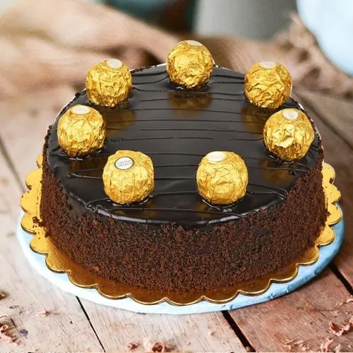 Amazing Chocolate Cake Recipe – decorated with Ferrero Rocher –  lovinghomemade